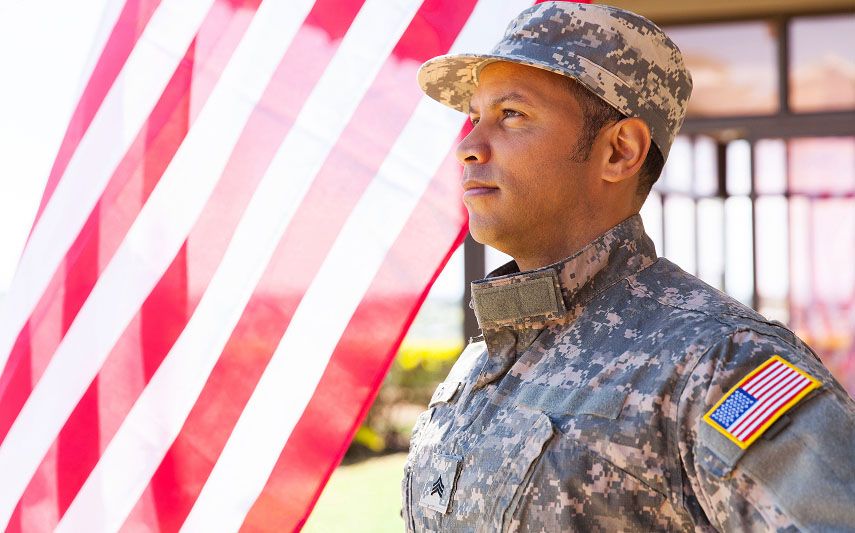 soldier facing flag