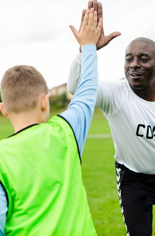 Coach and player high five